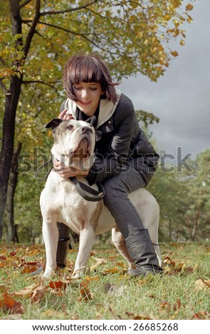 young woman and strong dog