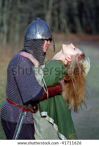 Young medieval couple, strong soldier and maid