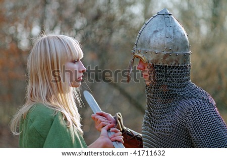 Young medieval couple, strong soldier and maid