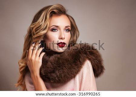 Beautiful Woman in Luxury Fur Coat. Sepia Toned.Vintage Style