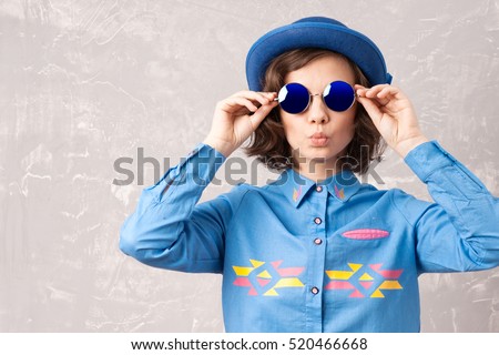 Cool hipster student woman wearing eyewear glasses . Caucasian female university student looking at camera smiling happy