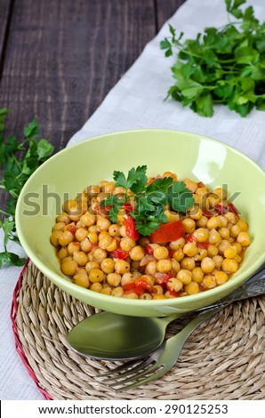 Chickpea stew with vegetables. Chickpeas, tomatoes, red pepper, garlic cooked with olive oil.