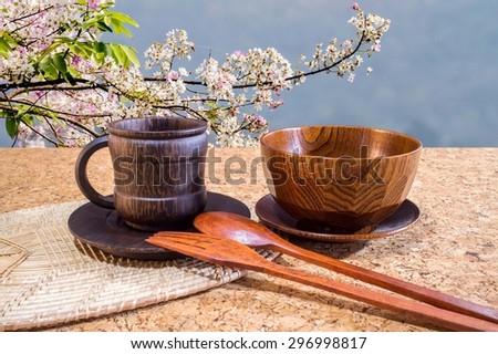 Coffee and drink  on the oak table with nature background. (wood cup)