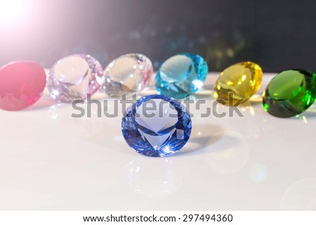Purple Diamonds subject and six diamonds  on black background and lens flare on left corner concept.