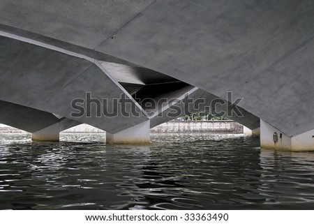 The underside of a bridge over the Singapore river in downtown Singapore