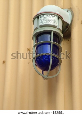 Safety light on side of tin building