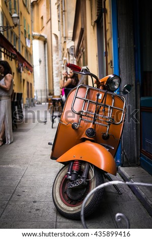 Vintage italian scooter in a alley of historic city center of Nice, France