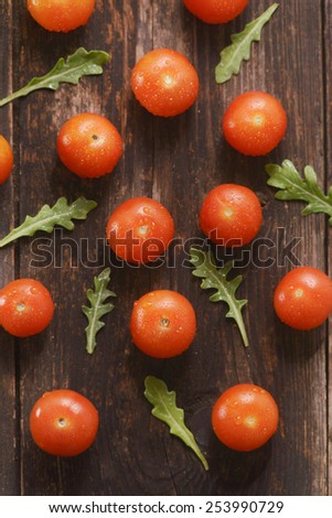 the cherry tomatoes on wooden background