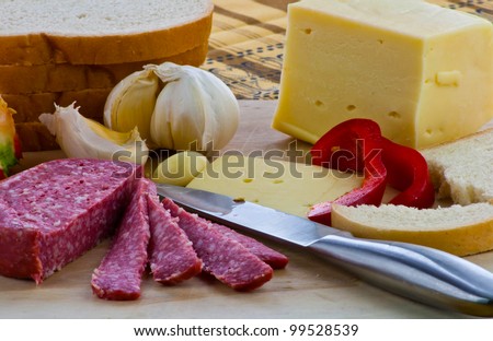 Group of different food type arranged on a wood plate