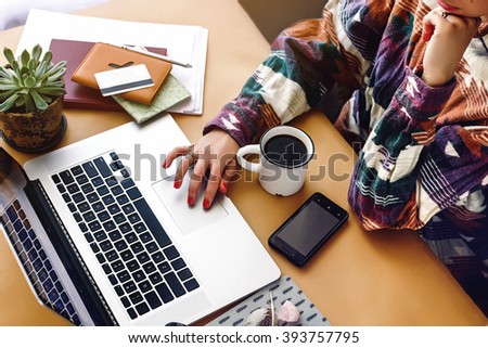 stylish girl hipster hands on laptop searching and typing, freelance and planning boho summer travel vacation concept
