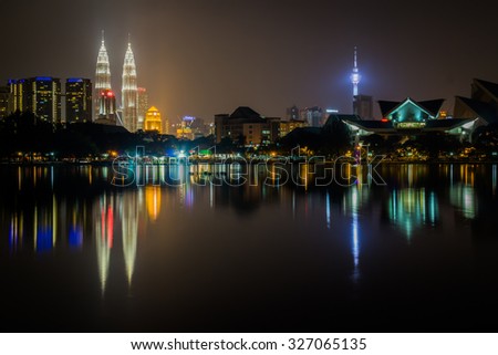 KUALA LUMPUR - AUGUST 05: Night scene of Kuala Lumpur city AUGUST 05, 2015 Night scene of Kuala Lumpur city with beautiful water reflection. Captured from Titiwangsa public park.