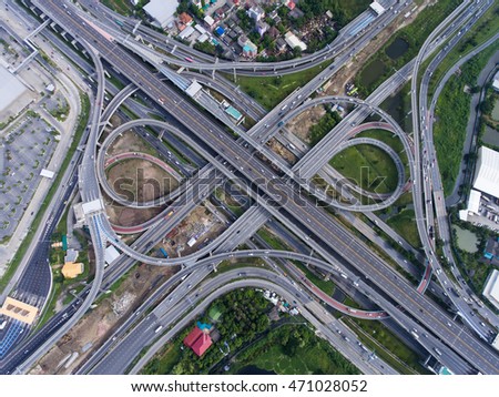 Aerial highway junction. Busy highway from aerial view. Highway shape like number 8 and infinity sign. Urban highway and lifestyle concept. Highway taken in the eastern highway of Bangkok Thailand.