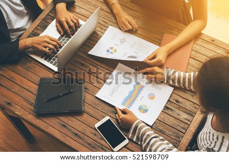 Business group meeting. Business report meeting and briefing. Three business people meeting on wooden table. Business teamwork concept. Background of business meeting. Corporate meeting. Plan meeting.