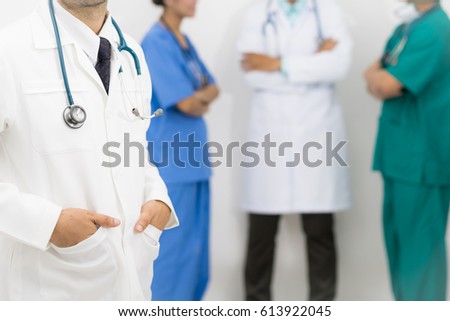 Medical people group including surgeon, nurse and doctors on white background. Selective focus at the front doctor.
