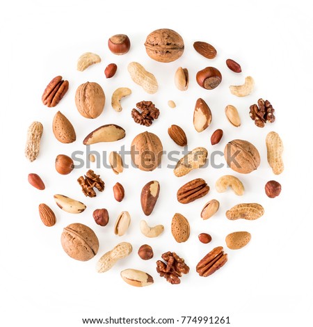 Pattern of nuts in circle form. Various nuts isolated on white. pecan, macadamia, brazil nut, walnut, almonds, hazelnuts, pistachios, cashews, peanuts, pine nuts. Top view or flat-lay. Copy space