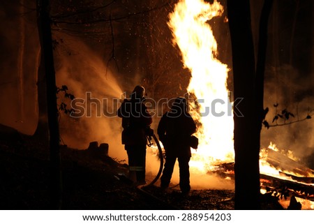 Fire fighters at a burning house