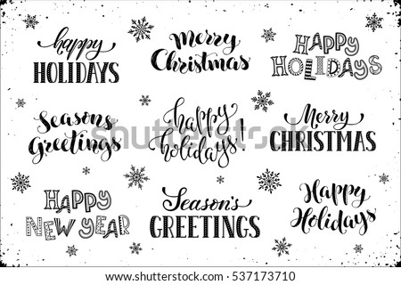 Hand written New Year phrases. Greeting card text  with snowflakes isolated on white background. Happy holidays lettering in modern calligraphy style. Merry Christmas and Season\'s Greetings lettering.