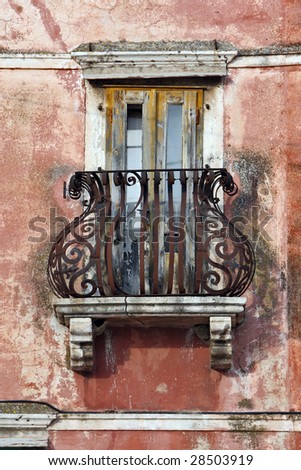 old balcony on mossy house