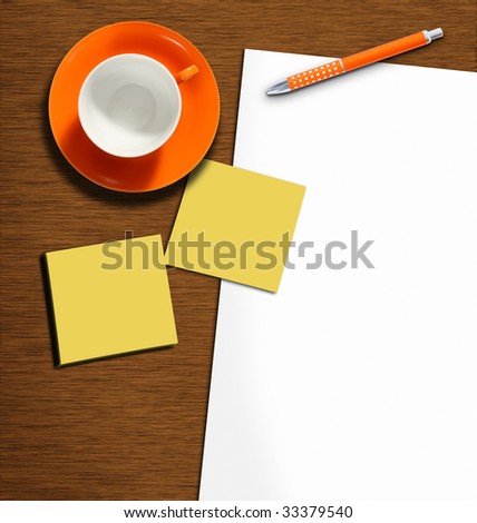 work desk with plain paper, pencil and empty coffeecup
