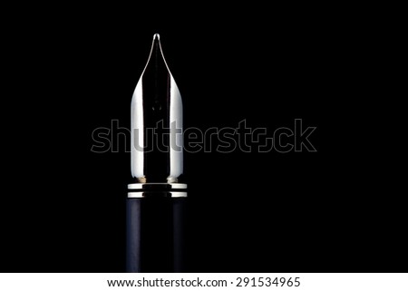 Traditional Fountain Pen nib isolated against a black background.