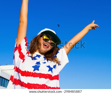 Freedom woman happy and free open arms on highest floor. Beautiful joyful elated woman looking up smiling by the positive during summer holidays vacation. Pretty multiracial brunette Caucasian girl.