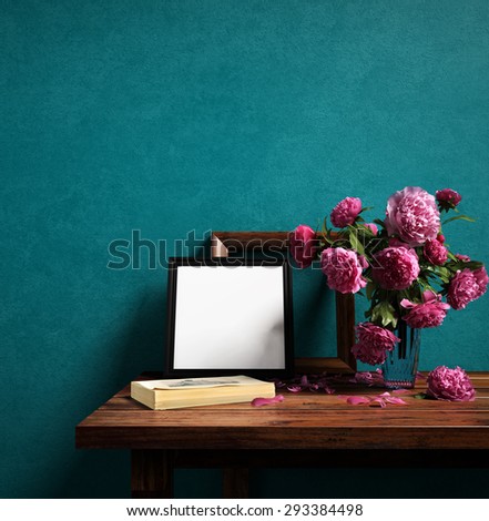 Frames and flower vase on color wall - 3D rendering