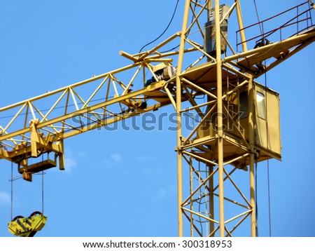 Cabin and the hoisting mechanism of tower crane