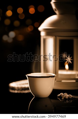 Arabian coffee with  lantern\
Ramadan mood at night with light decoration in the background.