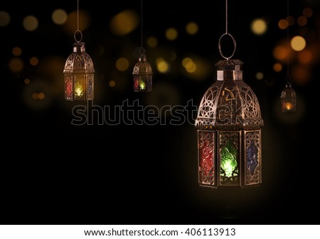 Vintage hanging lantern.\
Ramadan mood at night with light decoration in the background.