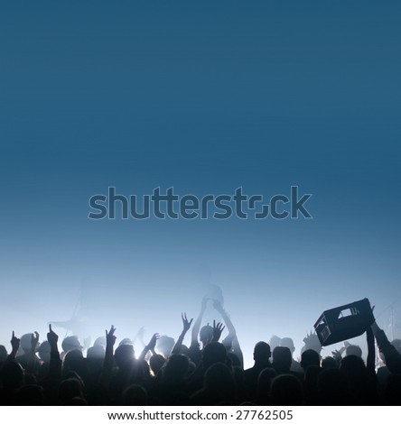 Thirsty concert crowd passing a beer crate / beverage case, fans raising hands at a concert, with copy space