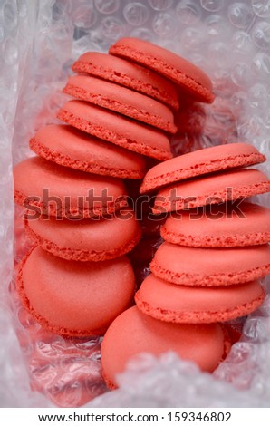 Pink macaroons wrapped in bubble wrap