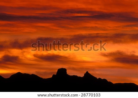 Mountain silhouette with beautiful colorful clouds