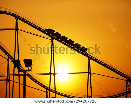 Evening sun and roller coaster