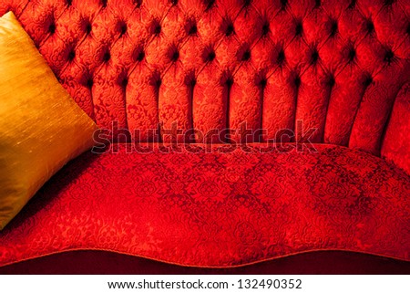 An antique old red Swedish velvet couch from the forties