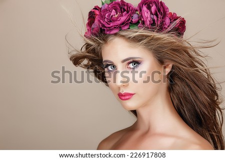 Beautiful woman with flowers. Perfect face skin. Beauty Portrait.