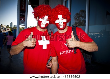 MELBOURNE, AUSTRALIA - JANUARY 23: Swiss fans get ready to watch Roger Federer(SUI)[2] defeat Tommy Robredo(ESP) at the Australian Open on January 23, 2011 in Melbourne, Australia