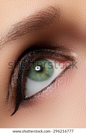 Close-up of woman green eye with beautiful arabic make-up. Oriental makeup