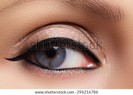 Close-up of woman blue eye with beautiful arabic make-up. Oriental makeup