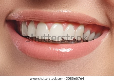 Perfect smile. Beautiful natural full lips and white teeth. Teeth whitening