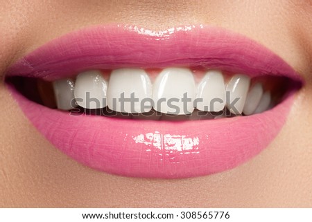 Perfect smile. Beautiful full pink lips and white teeth. Teeth whitening