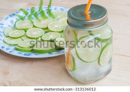 Lime slices with soda water , selective focus point.