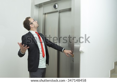 Businessman is confused because the elevator does not work