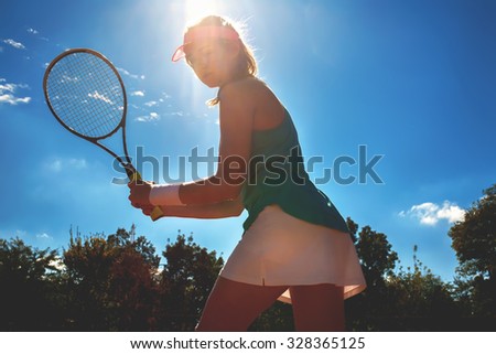 Portrait of a pretty young tennis player