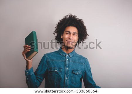 African-American student man with book isolated