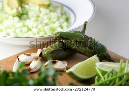 Green sauce ingredients including jalapeno, cucumber, avocado, garlic.