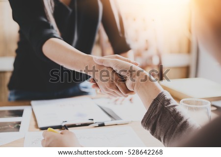 Negotiating business,Image businesswomen handshake,happy with work,business woman she is enjoying with her workmate,Handshake Gesturing People Connection Deal Concept