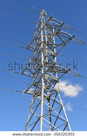 Electricity metal pole silhouette in blue sky