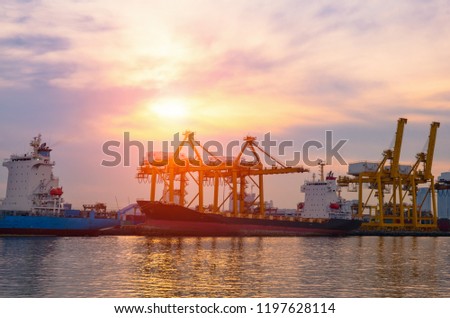 Container Cargo ship and cargo plane with working crane bridge in shipyard during sunrise,logistic import export and use for freight cargo.