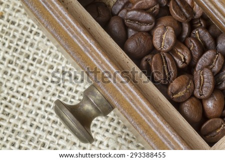 picking up coffee bean with tweezers