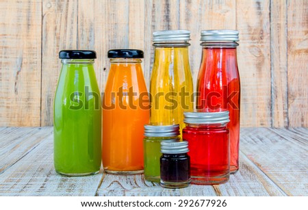 Juice bottle on wooden background